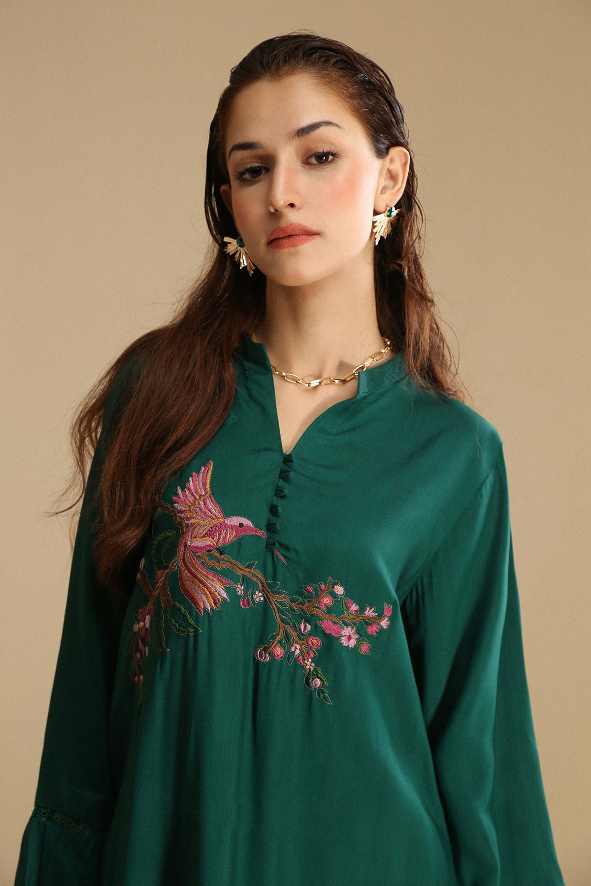 Mid length trendy shirt with embroidery on front